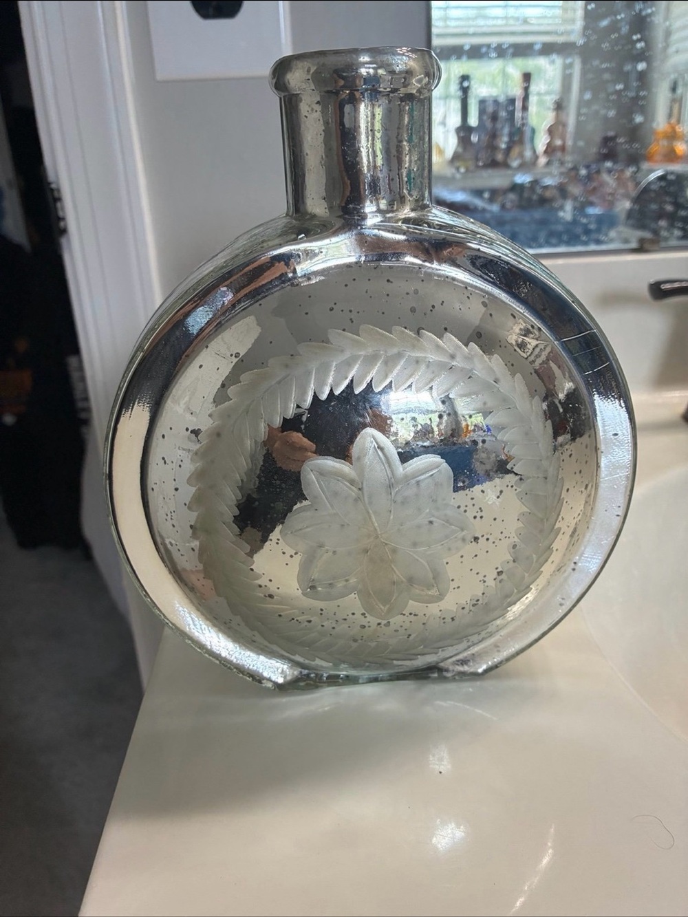 This is a retired, vintage-style mercury glass canteen